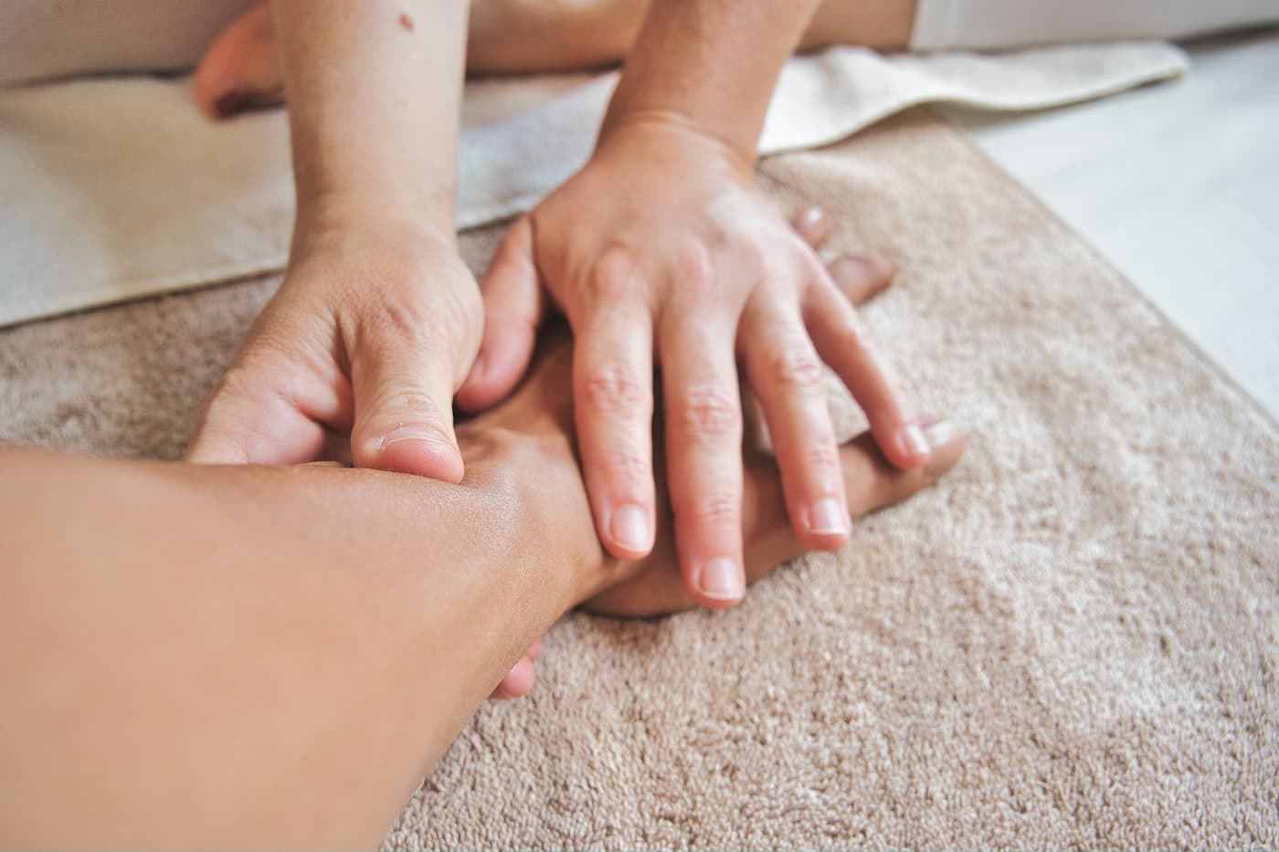 Therapist performing foot reflexology